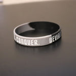 Empower Motivate Conquer Adult Grey and Black Wristband - Deviant Sway