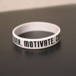 Empower Motivate Conquer Adult White Wristband - Deviant Sway
